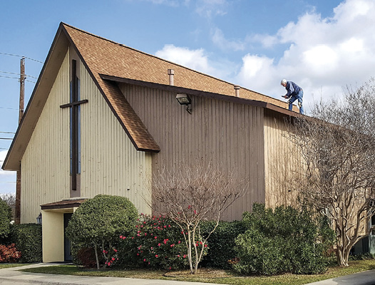 Member Pat Sandilands working on the church roof