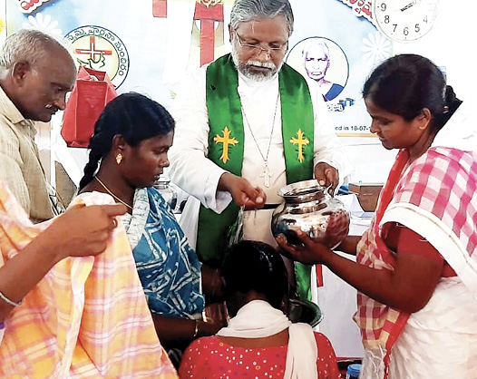 Young convert receiving Baptism