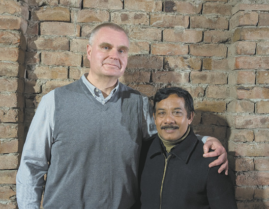 Two men standing next to each other, one is taller than the other.

AI generated content